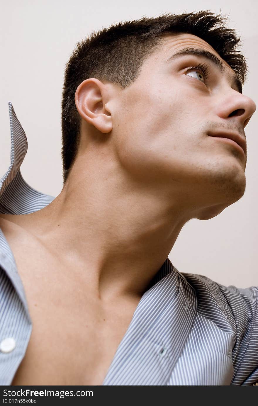 Young man looking up. close-up.