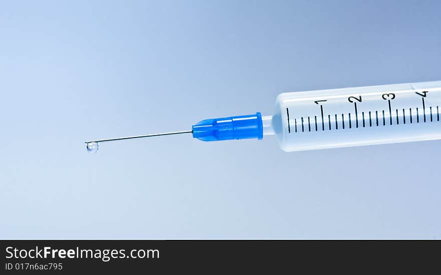 Syringe With Blue Drop