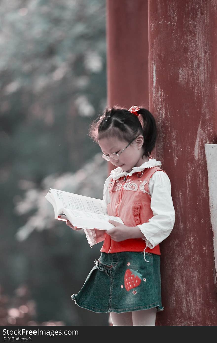 The girl read a book outside. The girl read a book outside.