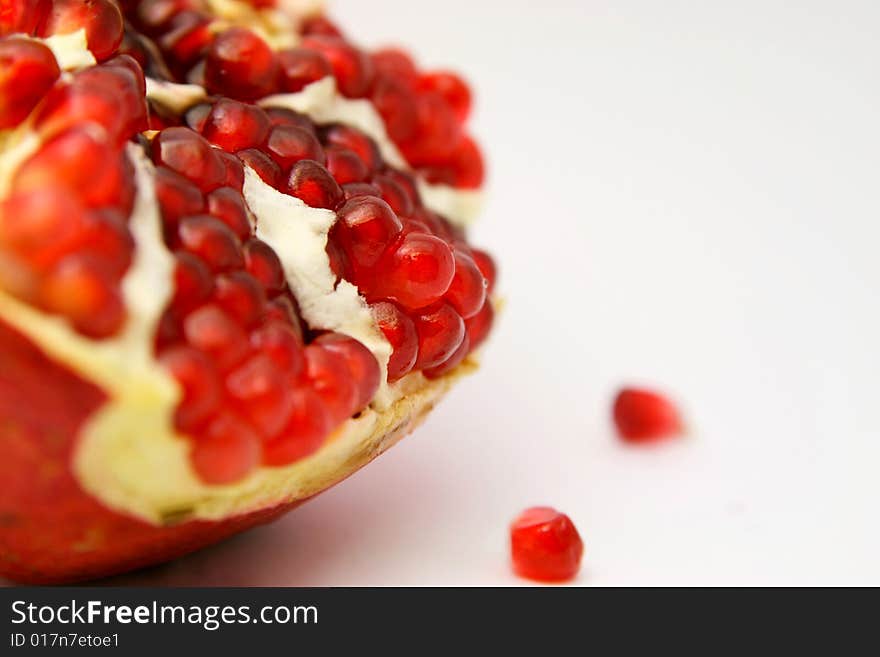 Colorful picture of juicy pomegranate on white background. Colorful picture of juicy pomegranate on white background