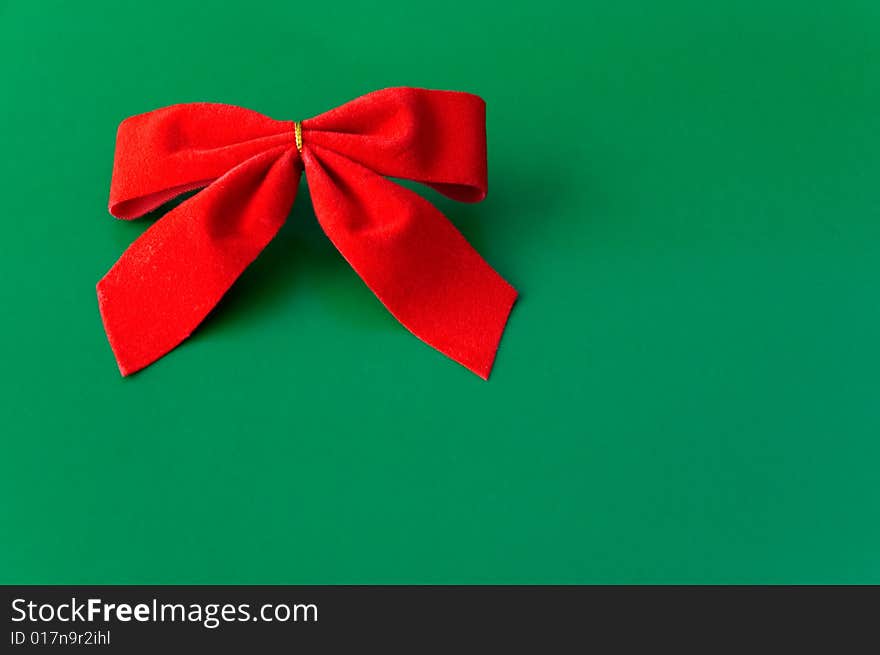 Red ribbon against a green background