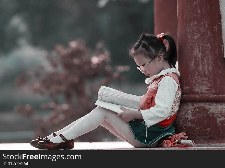 The girl read a book outside. The girl read a book outside.