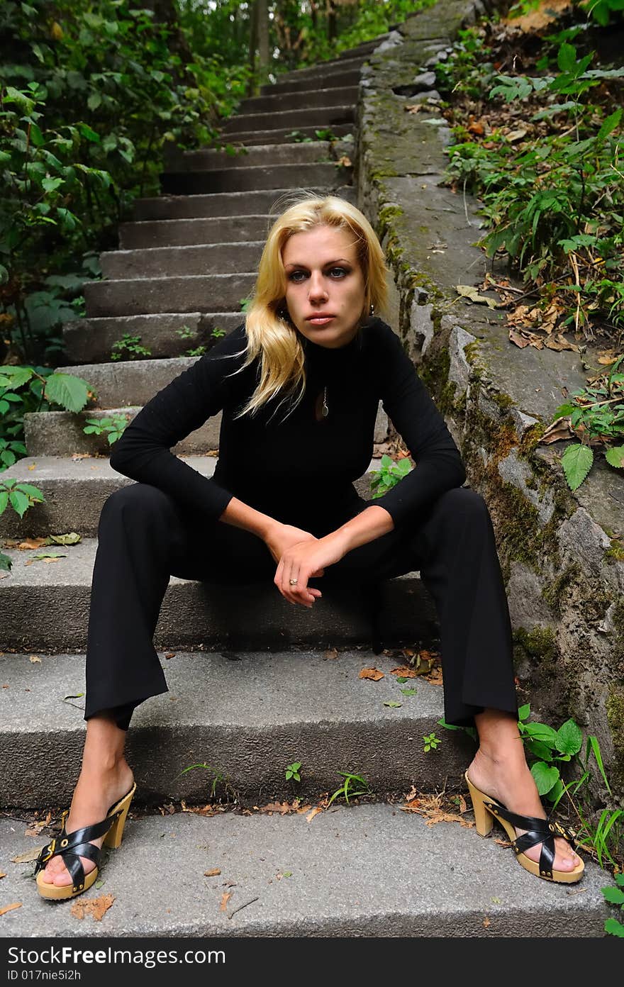 Sad blonde woman in black jersey. Sad blonde woman in black jersey