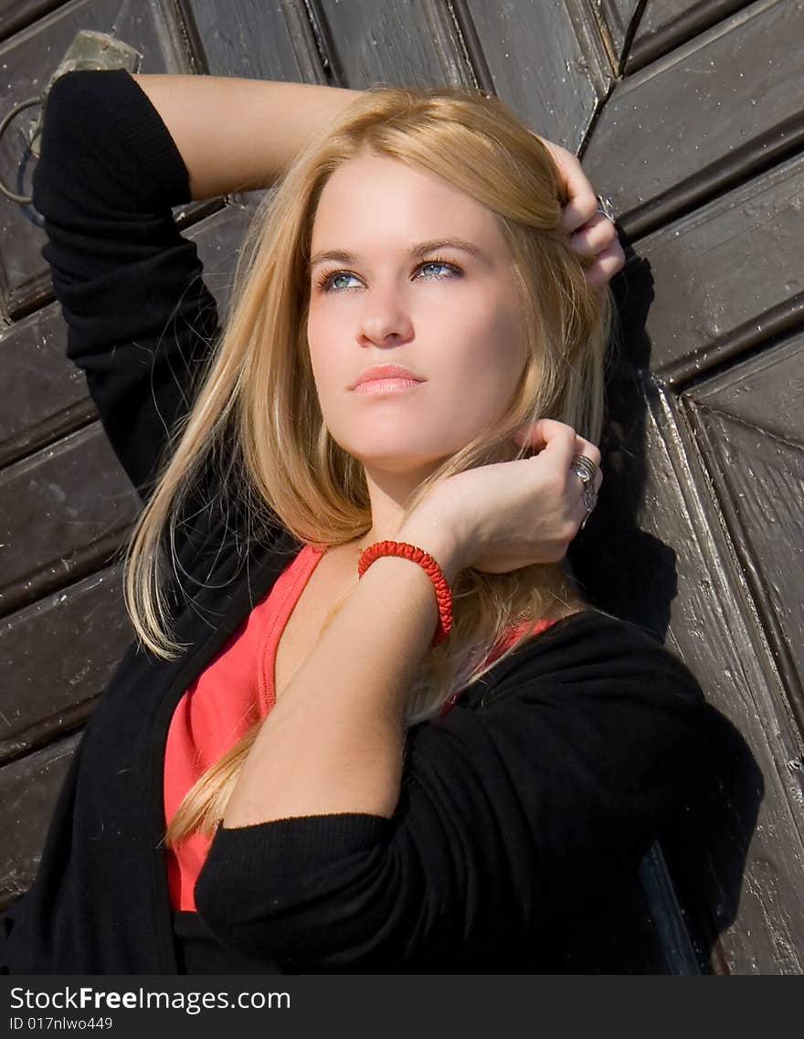 Beautiful blondy woman posing on autumn sunset