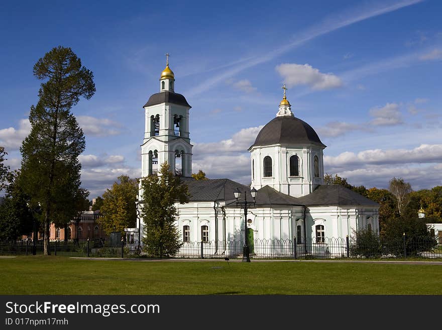 Old orthodox church in autumn park at sunny day