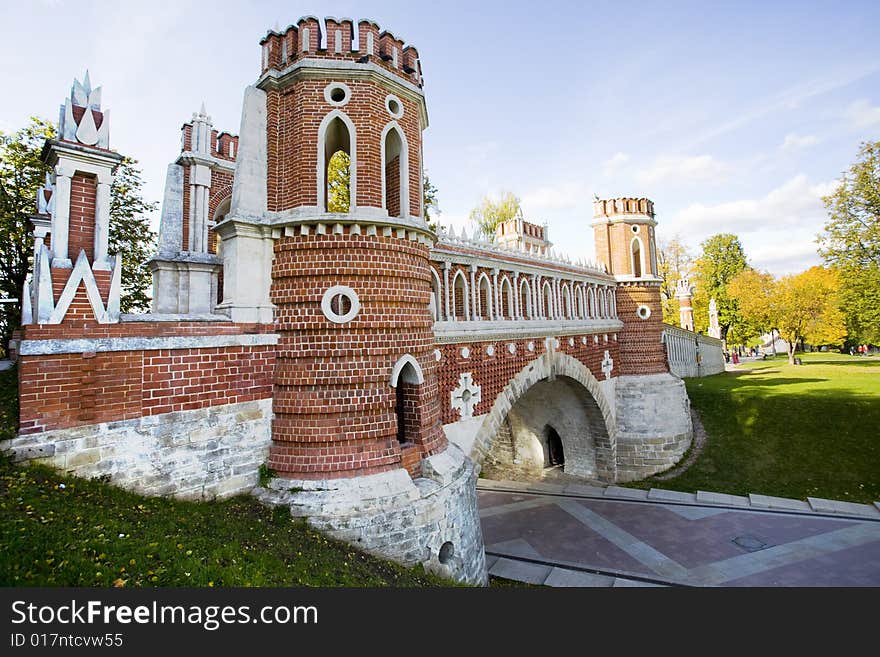 Old bridge in quin palace park at sunny autumn day