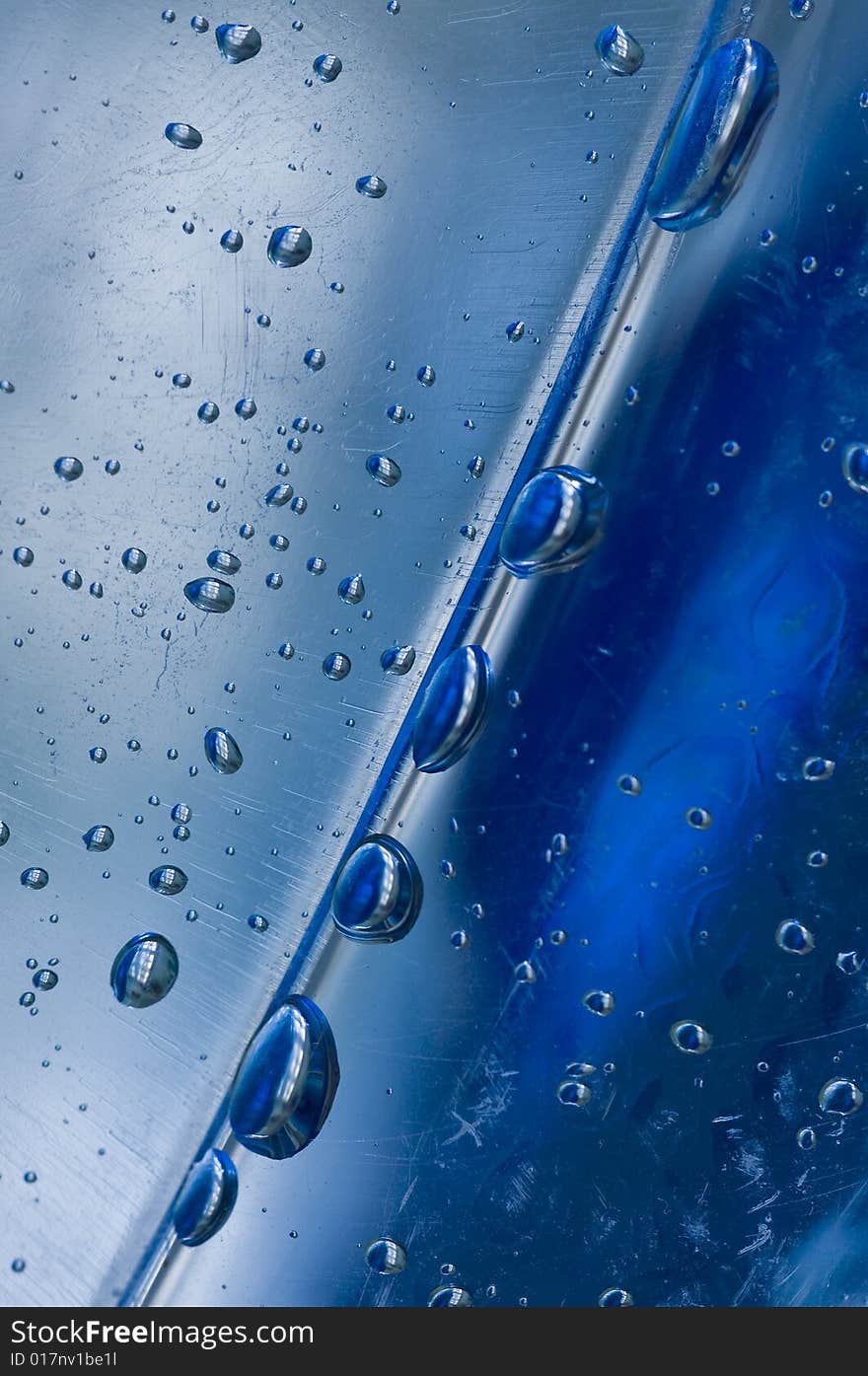 A closeup shot of droplets inside an empty mineral water container. A closeup shot of droplets inside an empty mineral water container.