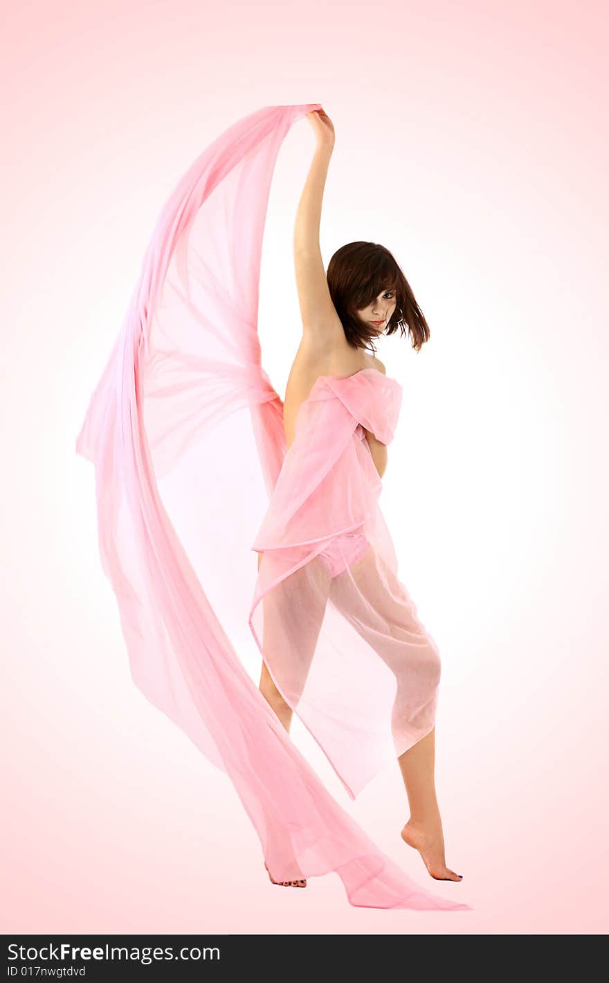 High brunette in a cape from a pink fabric