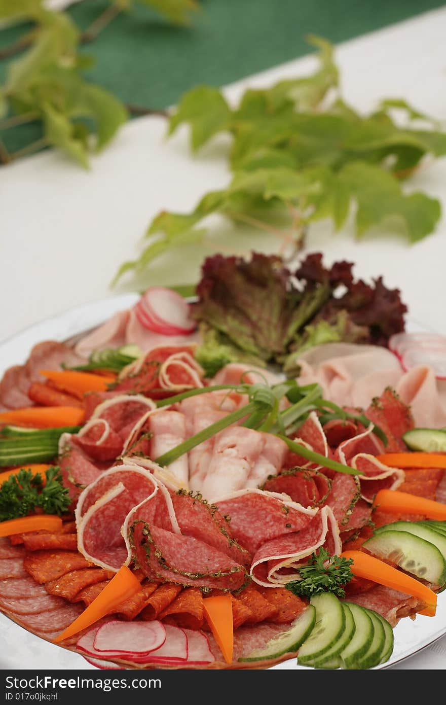 Salami and vegetable on the desk