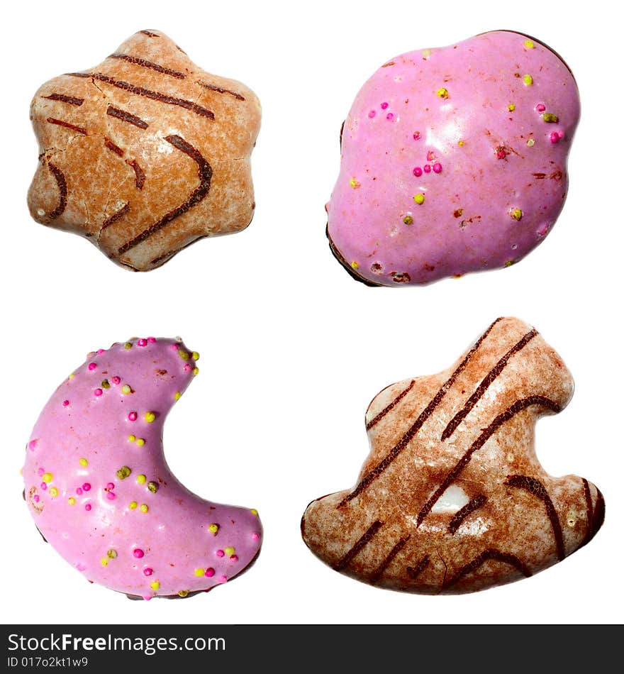 Multi-coloured chocolate spice-cakes on  white background