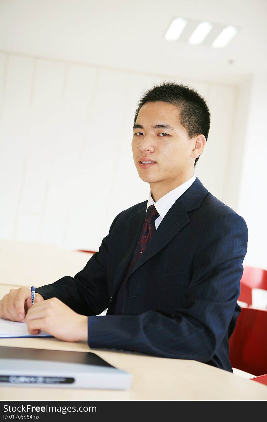 Young asian business man working in office