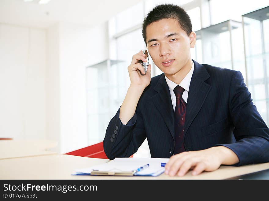 A young asian working in office