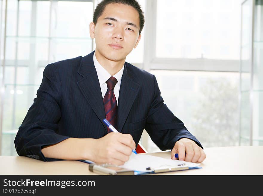 A young asian working in office