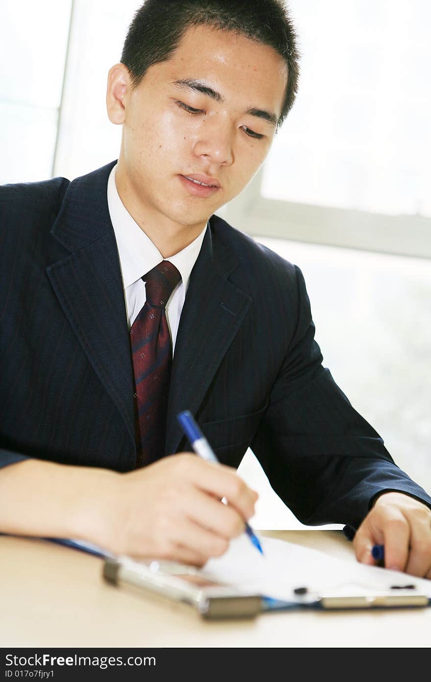 A young asian working in office