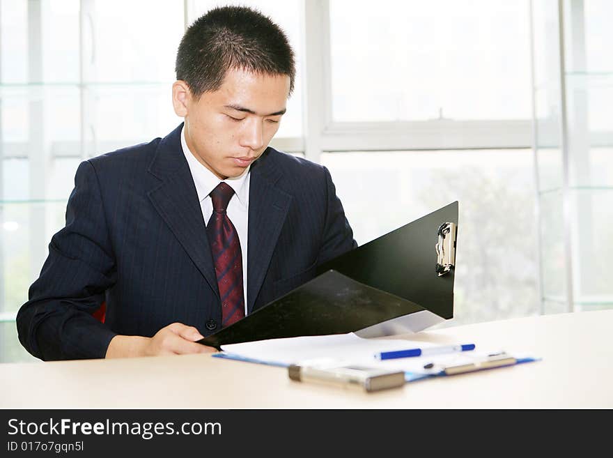 A young asian working in office