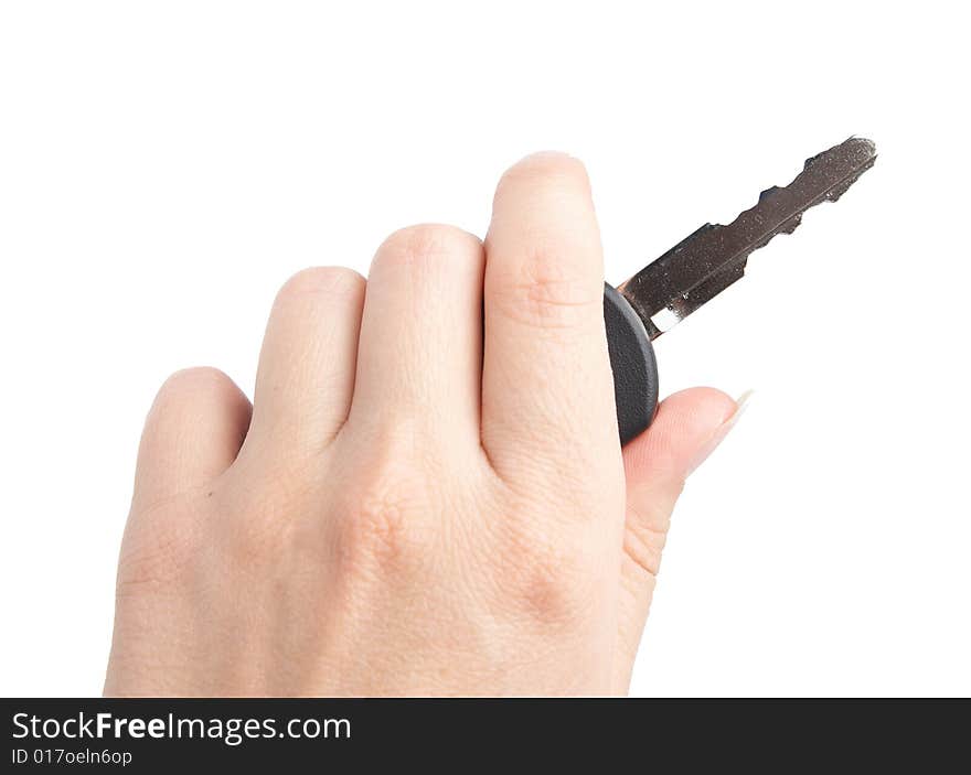 Keys from the car in a female hand. It is isolated