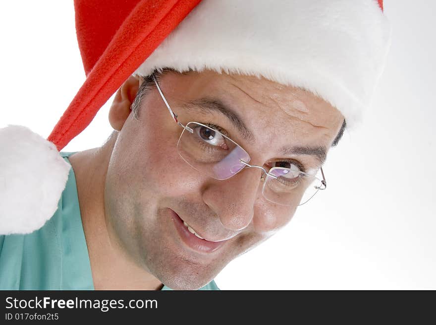 Doctor wearing christmas hat against white background