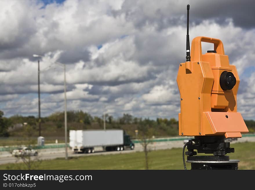 Survey on the highway - orange theodolite.