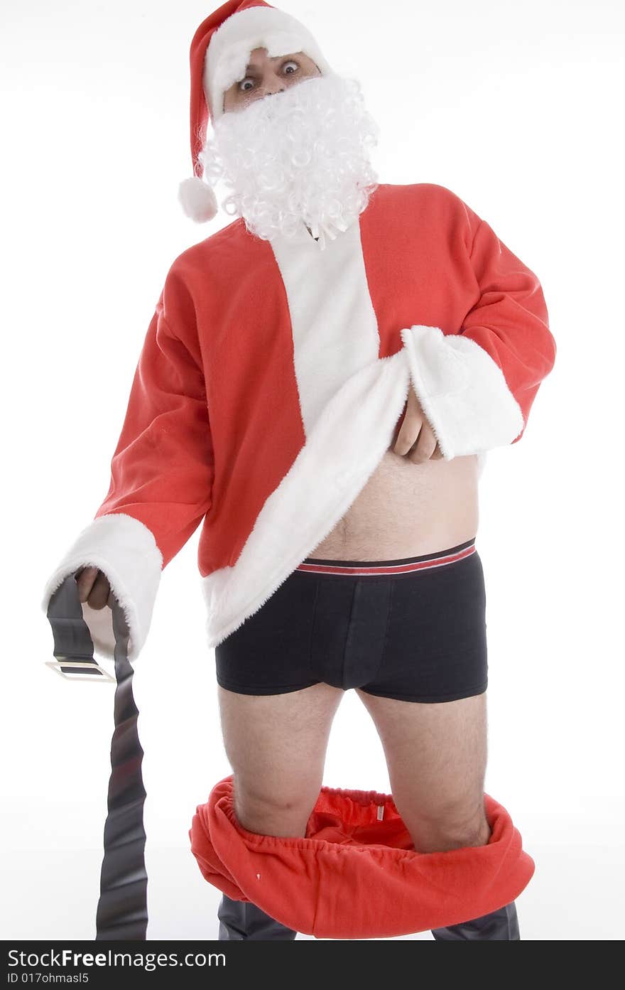 Santa clause holding his coat and belt on an isolated white background