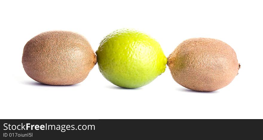 Two kiwies and lime isolated on white background