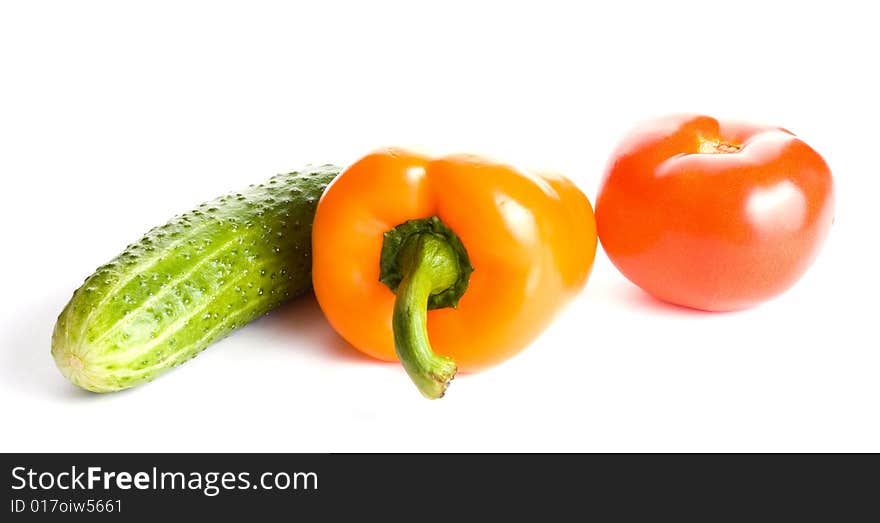 Cucumber, pepper and tomato isolated on white background