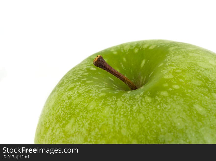 Detail of a granny smith apple isolated on white background