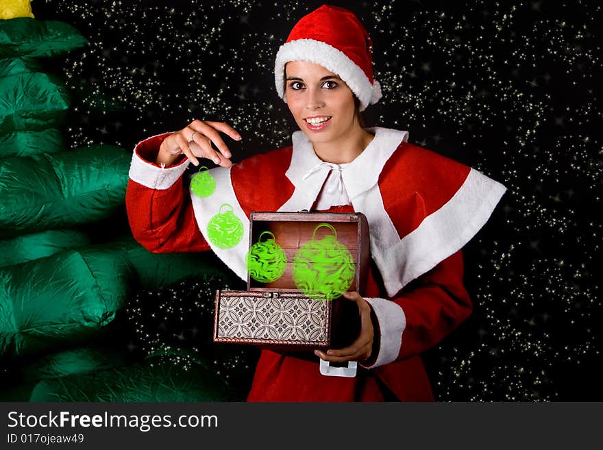 Beautiful sexy girl wearing santa claus clothes near christmas tree