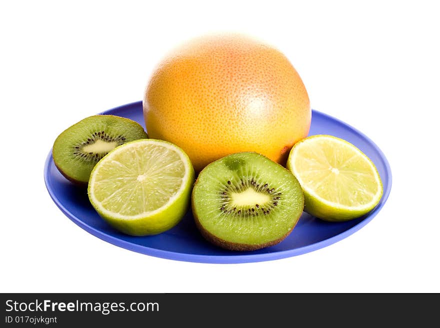 Few fruits on plate isolated on white background