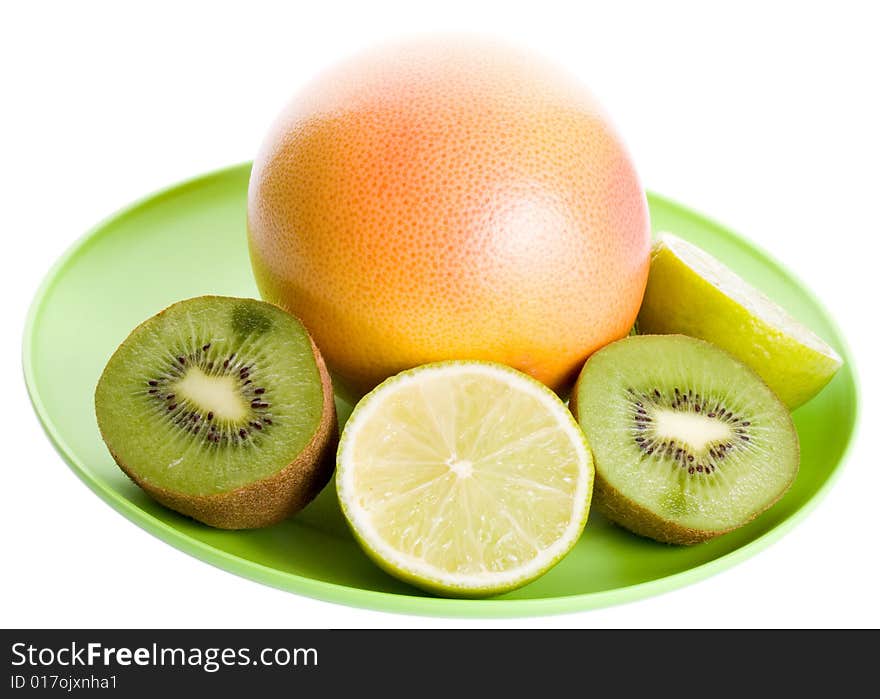 Few fruits on plate isolated on white background