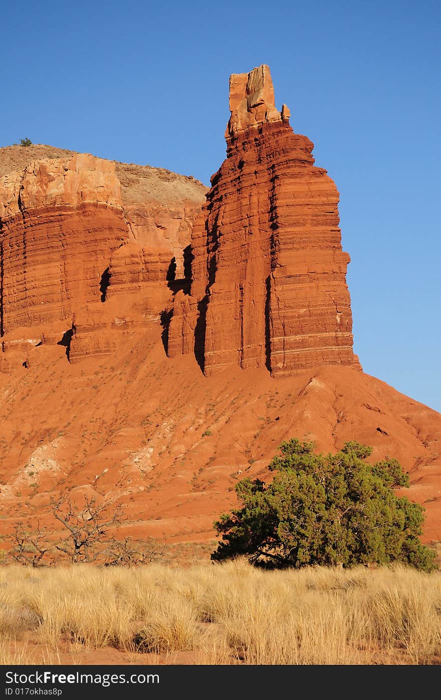 Rock tower and field in utah