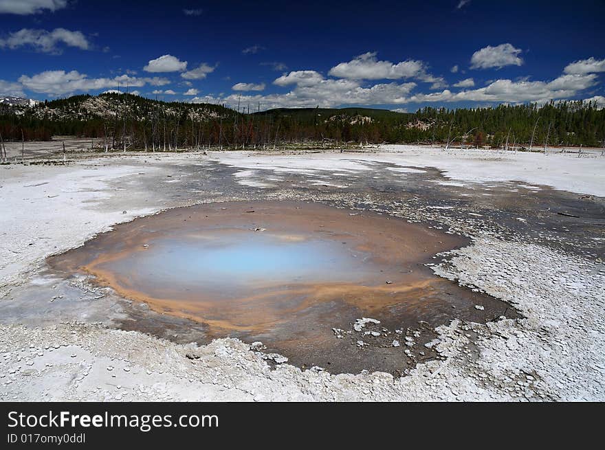 Volcanic hot pool in yellowstone national park on a beautifull spring day. Volcanic hot pool in yellowstone national park on a beautifull spring day.