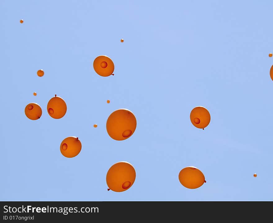 Orange balloons in the blue sky. Orange balloons in the blue sky.