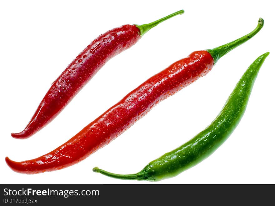 A shot of three isolated chilis. A shot of three isolated chilis