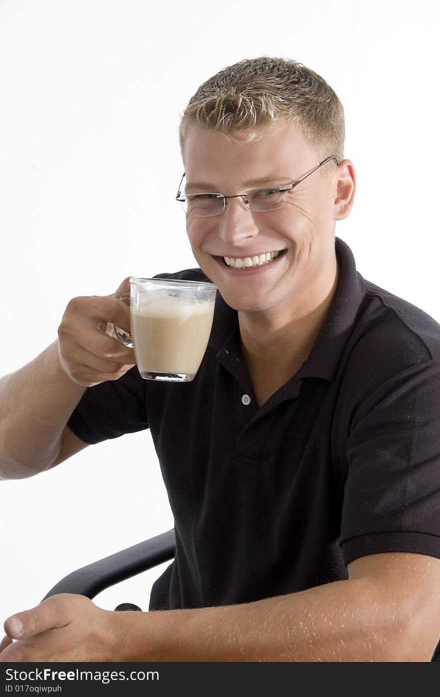 Pleased man taking tea