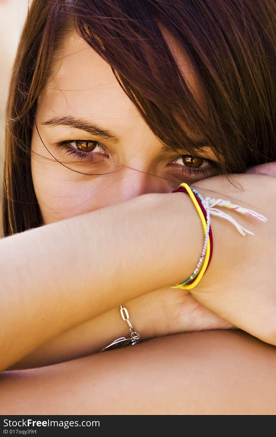 Young staring woman with her hair moved by the wind