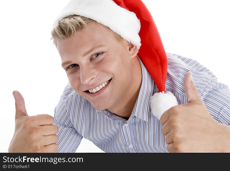 Happy man with christmas hat wishing good luck on an isolated background