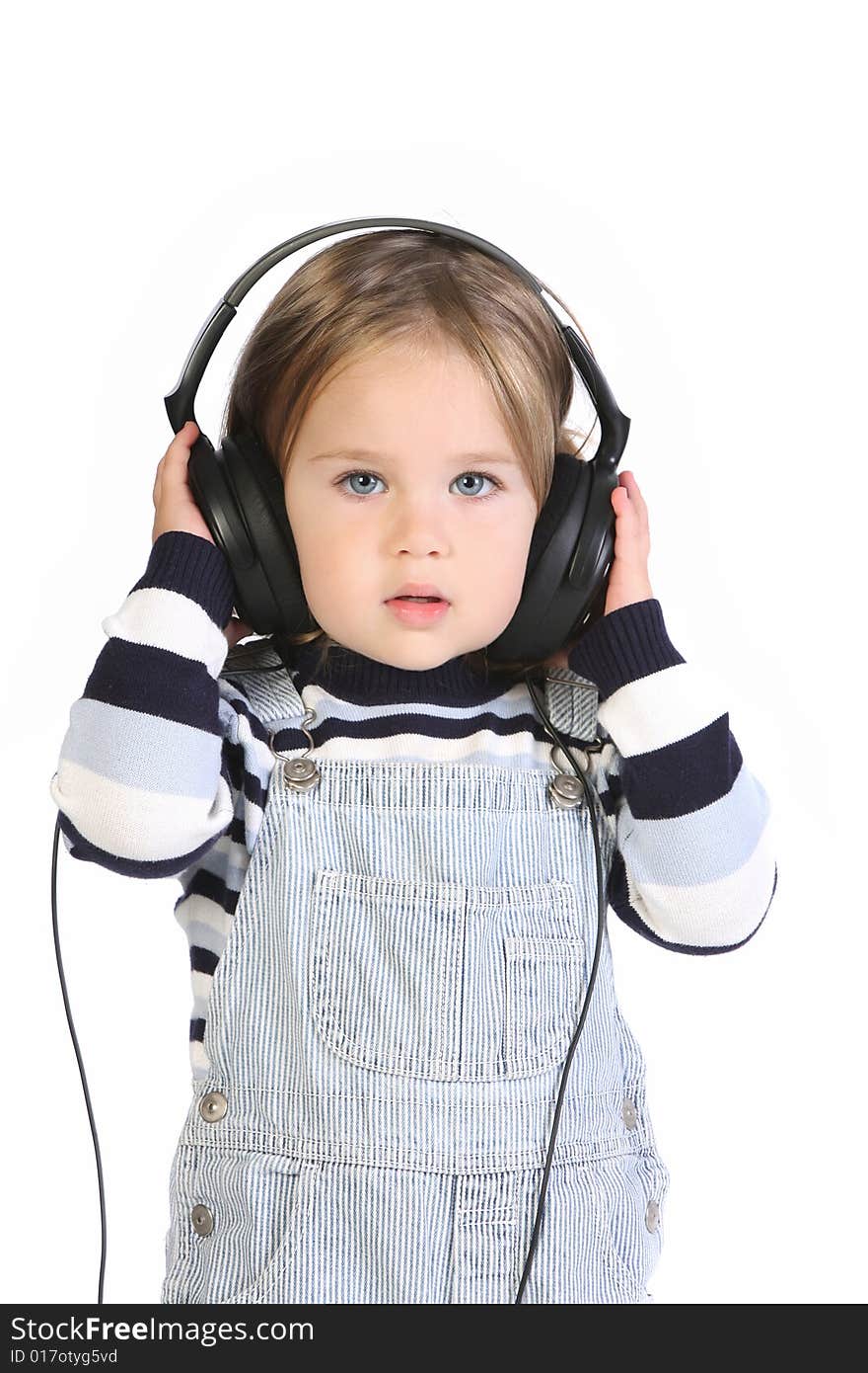 Beauty a little girl listening music on white background