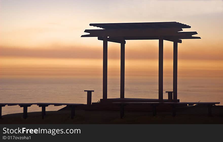 This is a picture of a brilliant sunrise on California's Big Sur coast with a gazebo in the foreground. This is a picture of a brilliant sunrise on California's Big Sur coast with a gazebo in the foreground.