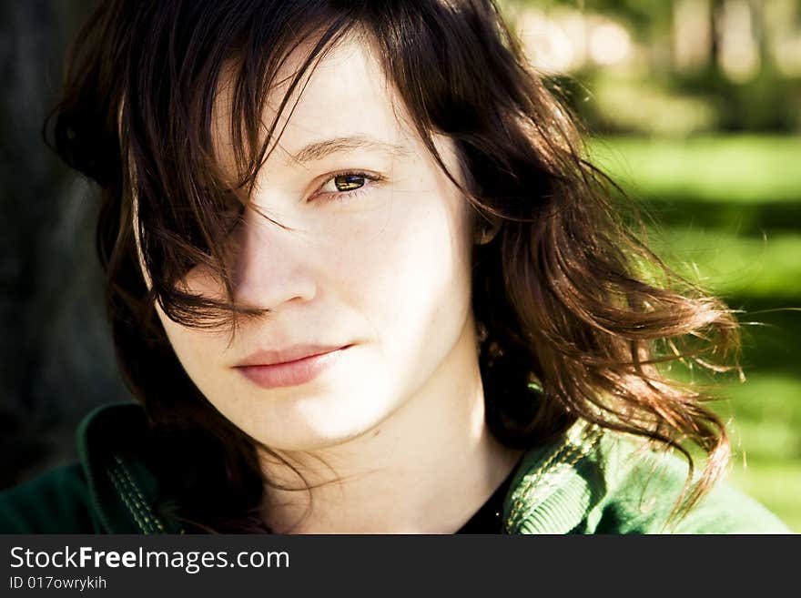 Young beautiful woman portrait with her hair on the wind. Young beautiful woman portrait with her hair on the wind.