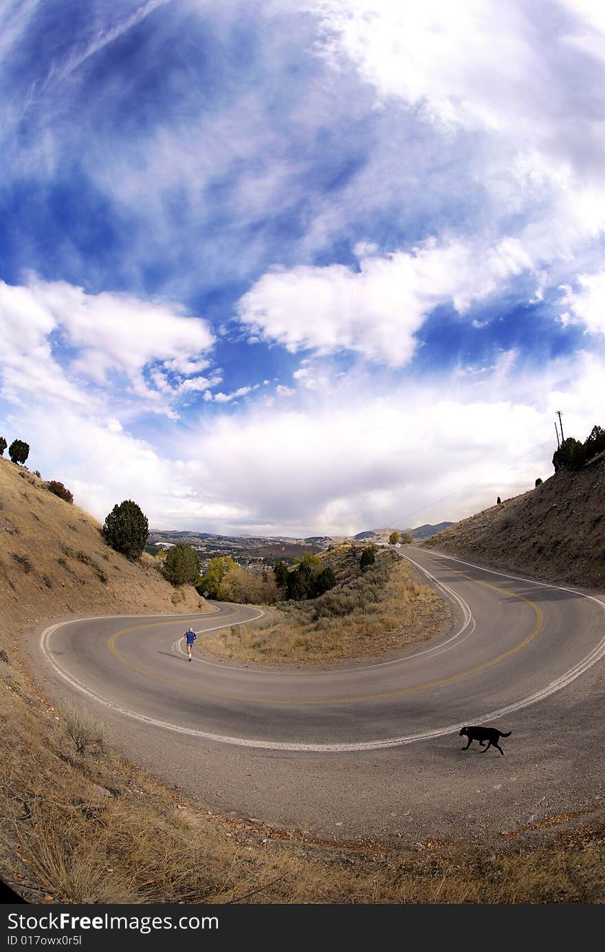 Country road with painted double yellow lines and big curve or turn. Country road with painted double yellow lines and big curve or turn