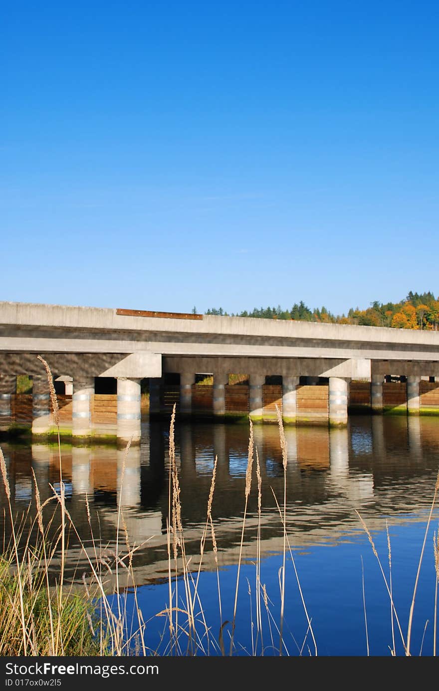 Highway Bridge over calm river. Highway Bridge over calm river