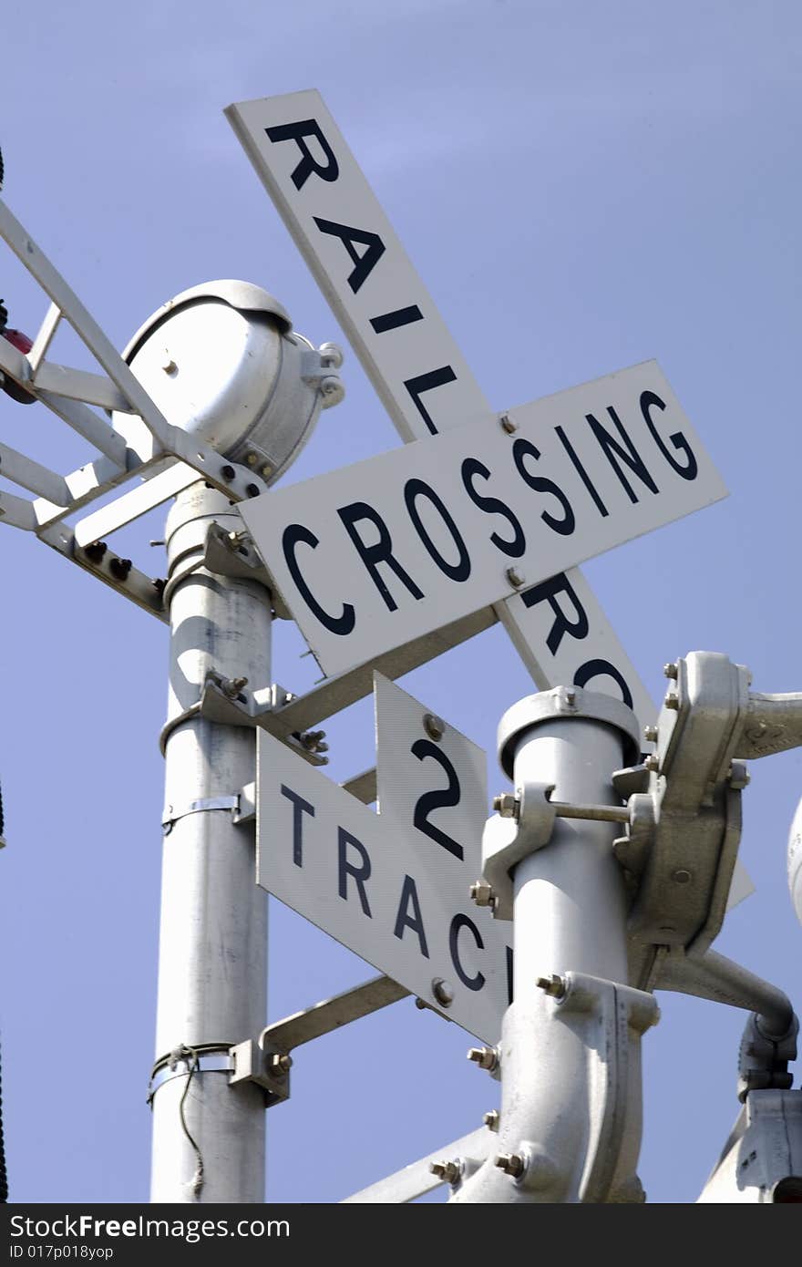 Looking up at railroad crossing sign for two track line.