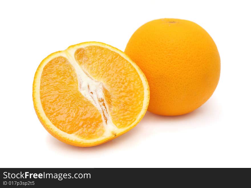 One and half oranges isolated on white background.