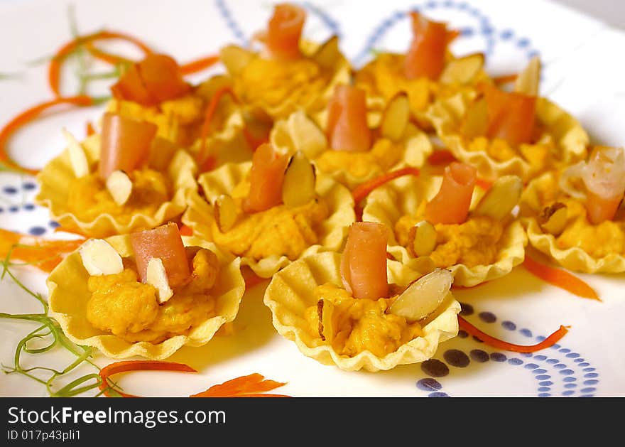 Appetizers with smoked salmon and almond in little baskets. Appetizers with smoked salmon and almond in little baskets