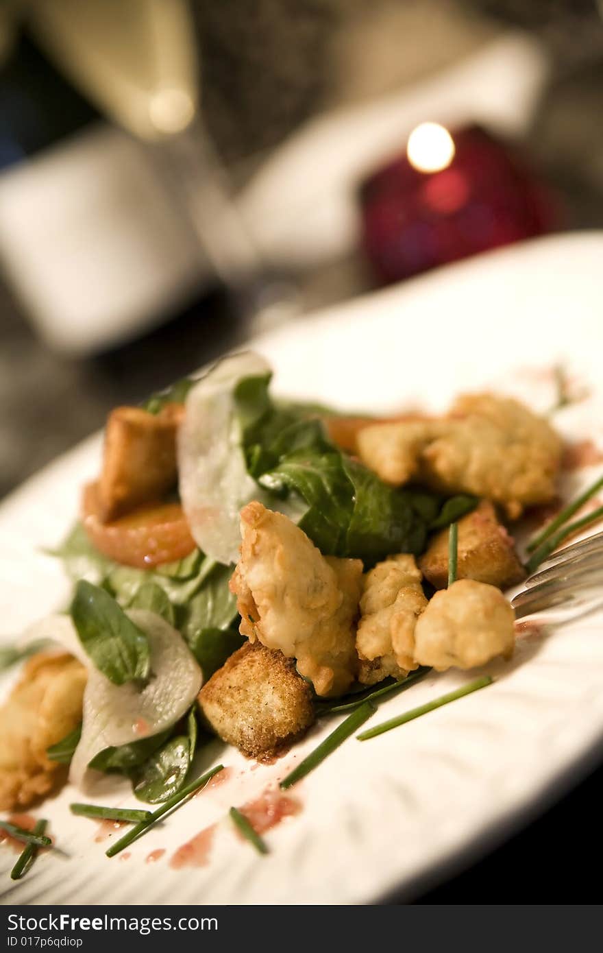 Fried Malpeque Oysters served with baby arugula, shaved fennel, blood orange vinaigrette, and cumin scented croutons