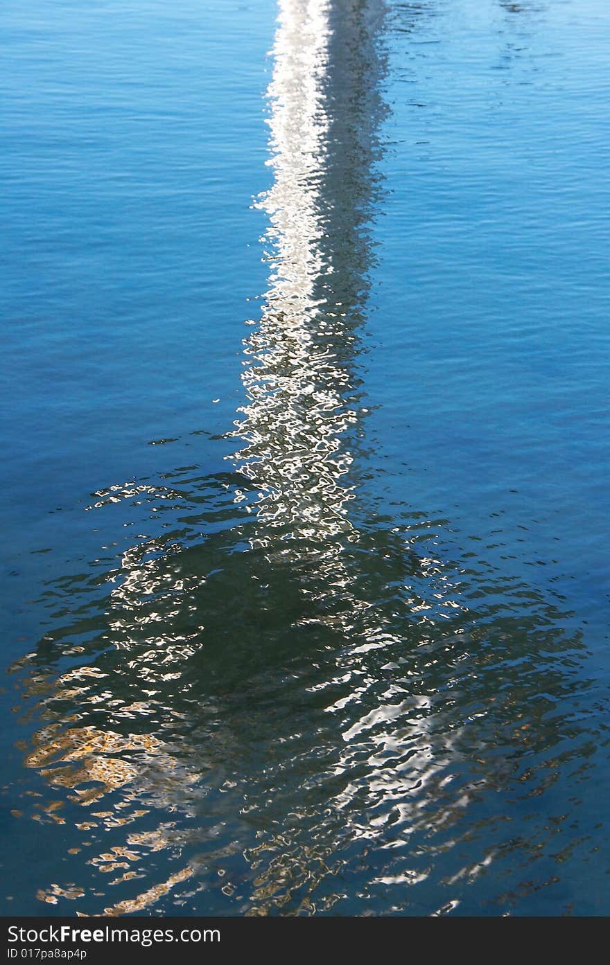 Textured rippled color water surface with abstract reflection. Textured rippled color water surface with abstract reflection