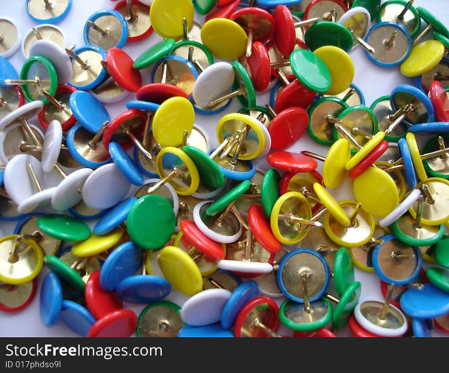 Colorful composition of a box with drawing pins