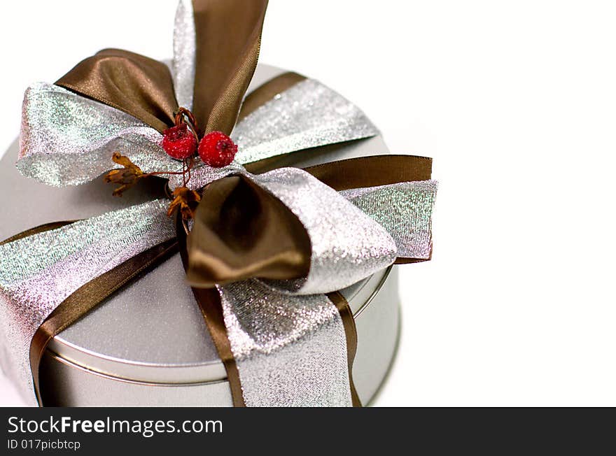 Metal gift box with beautiful bow closeup