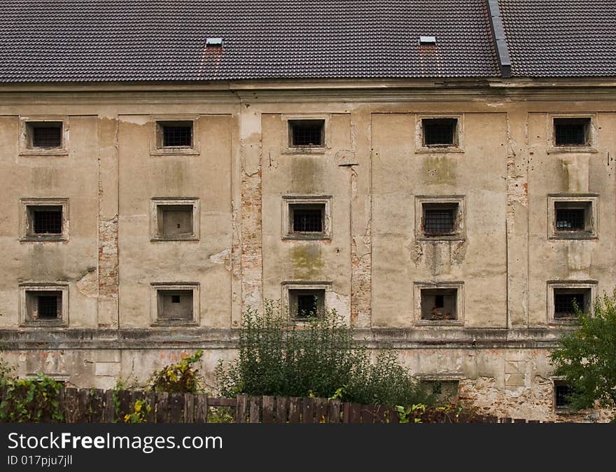 Windows and wall of an old prison.