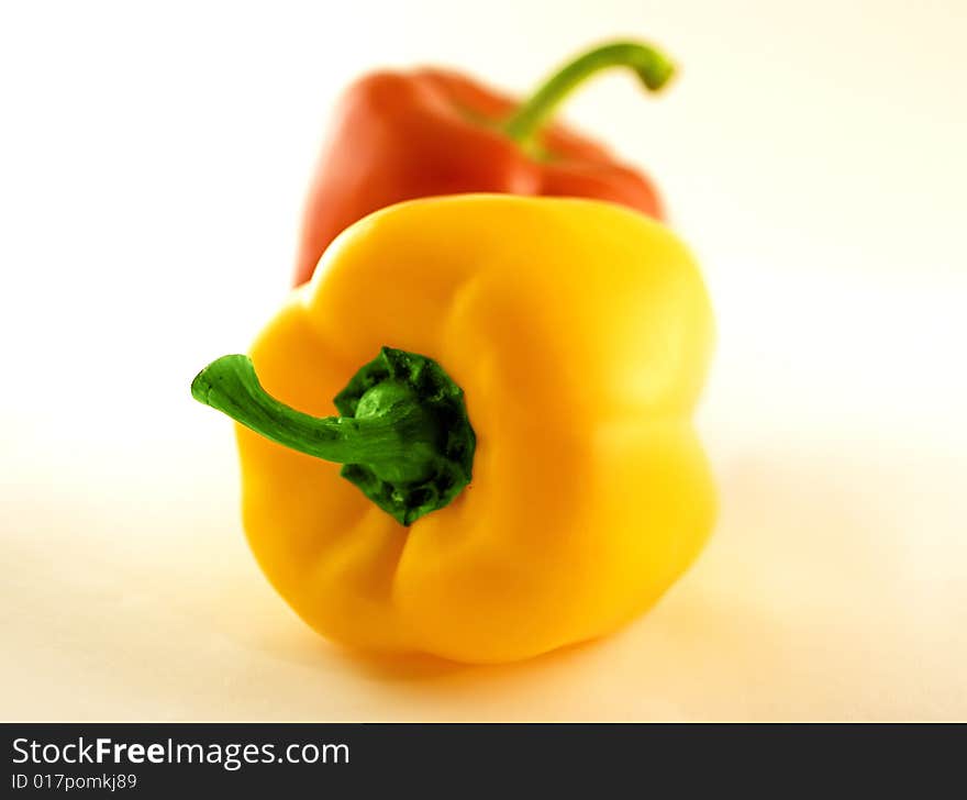 Sweet peppers lying on white background